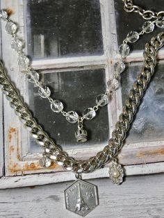 This is a fun eclectic double strand necklace. The Eiffel Tower Charm and the Crown are sterling silver. The perfect gift for that someone special. I T E M ∙ S P E C I F I C A T I O N S: - CHAIN LENGTH: Necklace is made with silver chain and crystal rosary bead chain. Silver chain is not sterling. Double Strand- Short strand is 20" in length, Longest Strand is 24" - you can link the clasp in another loop and make it shorter if you prefer. - PENDANT SIZE: Sterling Silver Crown is 1/2" long, Paris Silver Sterling Silver Charm Necklaces For Layering, Silver Double Strand Necklace, Silver Sterling Silver Double Strand Necklace, Silver Double Strand Sterling Silver Necklace, Silver Multi-strand Necklace For Layering, Silver Multi-strand Charm Necklace For Layering, Silver Double Strand Necklace For Layering, Silver Double Chain Charm Necklaces, Silver Multi-strand Charm Necklaces As Gift