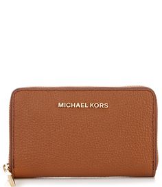 From Michael Kors&#x2C; the Jet Set Small Zip Around Pebble Leather Card Case Wallet features:Mercer pebble leatherRhodium gold-tone hardwareZip closureInterior center card pocket&#x2C; 2 back card pockets&#x2C; 2 front card pocketsExterior back slip pocketApprox. 5" W x 3.25" H x 0.75" DImported. Brown Michael Kors Wallet With Interior Card Slots, Michael Kors Brown Wallet With Interior Card Slots, Classic Brown Michael Kors Wallet, Michael Kors Brown Leather Wallet, Classic Michael Kors Leather Wallet, Michael Kors Brown Wallet For Everyday, Michael Kors Brown Travel Wallet, Michael Kors Brown Wallet For Travel, Card Case Wallet