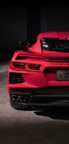 the rear end of a red sports car