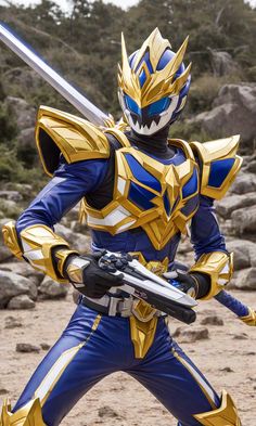 a man dressed in blue and gold holding two swords while standing on dirt ground next to rocks