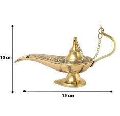 a brass oil lamp with chain hanging from it's side and measurements for the size