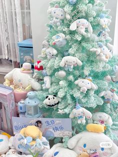 there are many stuffed animals around the christmas tree