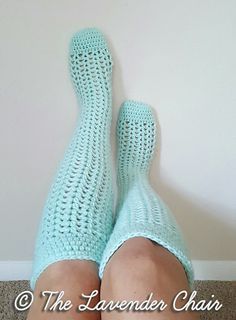 a woman's legs wearing blue crochet socks