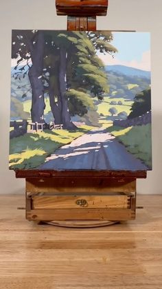 an easel with a painting on top of it