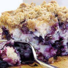 a piece of blueberry crumb cake with a fork