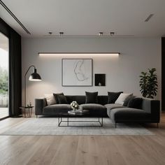 a living room filled with furniture next to a large glass wall window on top of a hard wood floor