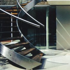 a metal spiral staircase in front of a building