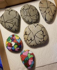 some rocks with different designs on them