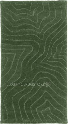 a green rug with wavy lines on it