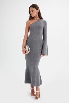 Expertly crafted from a wool blend enhanced with cashmere using luxurious yarn spinning techniques, the HUDA asymmetric midi dress offers a soft and comfortable fit. The knitted construction showcases skilled craftsmanship, while the one-shoulder neckline and fitted bodice accentuate the figure. With a fluted cuff and fishtail hem, this midi dress exudes elegance and sophistication. Fabric and Fit: Fine Yarns Wool Blend Enhanced with Cashmere 47% Wool, 38% Viscose, 10% Nylon, 5% Cashmere Stretch Luxury Fitted Midi Sweater Dress, Luxury Knit Midi Dress, Luxury Jacquard Knit Midi Dresses, Luxury Knit Midi-length Dress, Elegant Ribbed Midi-length Sweater Dress, Flare Midi Dress, Yarn Spinning, Lavish Alice, Knitted Dresses