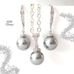 "The listing is for the Earrings AND Necklace set shown in the first picture. Timeless and classic Pearl Earrings and Necklace set made with: - lustrous 10mm round Light Grey pearls (NOT cheap glass pearls) - Hypoallergenic Rhodium plated rhinestone ear hooks - rhodium plated and tarnish resistant beautiful Cubic Zirconia/CZ embellished bail and sparkly connectors - the earrings are about 1 1/4\" from top of the ear wires to bottom of the pearls - The pendant drop is 7/8\" (23mm) Finished with a Pearl Earrings And Necklace, Handmade Pearl Jewelry, Classic Pearl Earrings, Grey Pearl Earrings, Bridal Bracelet Pearl, White Pearl Jewelry, Earrings And Necklace Set, Round Light, Bridal Earrings Pearl