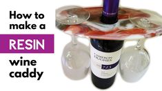 there is a wine glass holder with three wine glasses on it and the words how to make a resinin wine caddy