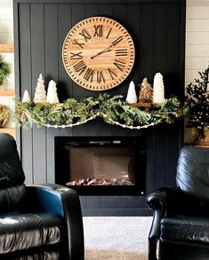 a living room filled with furniture and a clock on the wall above a fire place