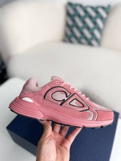 Embrace your bold side with these Dior B30-inspired sneakers in a head-turning pink. This vibrant design, crafted with breathable mesh and technical fabric, is perfect for those who want to make a statement. The sporty silhouette and lightweight construction ensure all-day comfort, while the signature "CD30" logo adds a touch of Dior's iconic style. Whether hitting the gym or the streets, these sneakers will elevate your look with a pop of color and undeniable confidence. Disclaimer: This produc Dynamic Pink Sneakers For Jogging, Pink Mesh Running Shoes With Rubber Sole, Pink Low-top Running Shoes Medium Fit, Pink Low-top Running Shoes With Medium Fit, Dynamic Pink Sneakers With Boost Midsole, Dynamic Pink Running Shoes With Abzorb Midsole, Pink Sporty Running Shoes, Functional Pink Mesh Sneakers, Pink Mesh Sneakers For Training