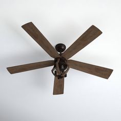 a ceiling fan with four wooden blades on it's sides and two light bulbs at the top