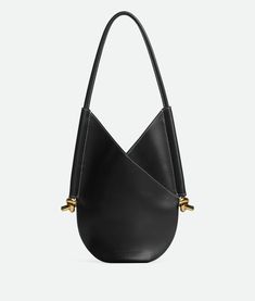 "Find BOTTEGA VENETA Small Solstice on Editorialist. Small calf leather shoulder bag. Single detachable interior zipped pocket. Leather string closure. Lining: Suede. Color: Black. Hardware: Brass finish. Height: 30 cm | 11.8\". Width: 26 cm | 10.2\". Depth: 2 cm | 2.6\". Handle drop: 26 cm | 10.2\". Calfskin." Designer Leather Hobo Bag For Work, Structured Leather Bucket Bag, Elegant Evening Hobo Bag With Leather Lining, Evening Hobo Bag In Textured Calf Leather, Elegant Calf Leather Hobo Bag With Leather Lining, Elegant Calf Leather Hobo Shoulder Bag, Evening Textured Calf Leather Hobo Bag, Elegant Leather Hobo Bag For Work, Elegant Hobo Bag With Magnetic Closure For Work