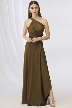 Olive green one shoulder gown with front drape and side cutout.
Components:1
Neckline:Asymmetrical
Sleeve Length:Asymmetrical
Fabric:Satin
Color:Green
Cutout back
Pleated front
Knot detail
Closure: Back zip - Aza Fashions Gown Green, Gown For Women, Gowns For Women, One Shoulder Gown, Gowns Online, Satin Color, Green Satin, Designer Gowns, Indian Design