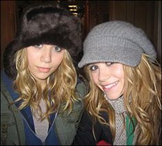 two young women wearing winter hats and scarves