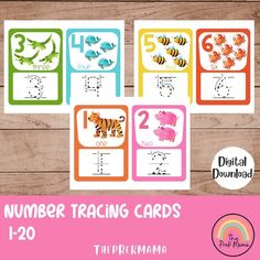 the number matching cards for numbers 1 - 20 are displayed on a wooden table with pink and