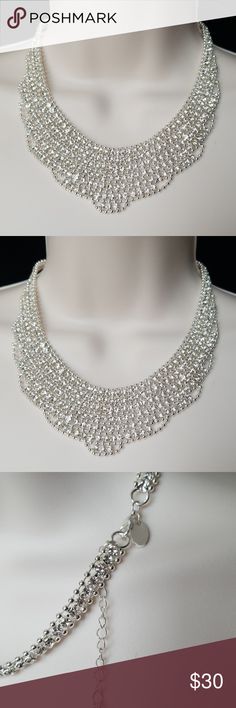 Rhinestones Bib Necklace Gorgeous elegant Rhinestones Bib Necklace.  Color: Silver Measurements:16" Long + 2" extender Measures 1.5 " wide at the widest middle point.  New with tag.  Item # RR- 6470-3 CRSVP Jewelry Necklaces Party Crystal Necklaces, Glamorous Round Crystal Rhinestone Necklace, Round Rhinestone Necklace For Party, Silver Beaded Rhinestone Necklace For Evening, Silver Backdrop Necklace With Sparkling Stones For Party, Glamorous Beaded Wedding Necklaces, Glamorous Beaded Wedding Necklace, Crystal Rhinestone Necklace, White Rhinestone Round Necklace For Party