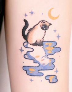 a cat sitting on top of a body of water next to a moon and stars