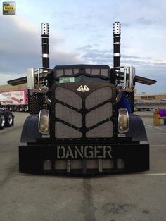 the front end of a large truck parked in a parking lot