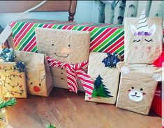 several presents wrapped in brown paper sitting on top of a wooden floor