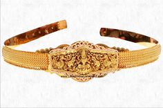 a gold belt with ornate designs on the front and sides, set against a white background