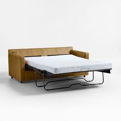 a couch with a pull out bed attached to it's back and side rails