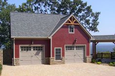 a red garage with two doors and windows