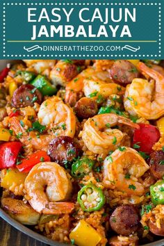 a skillet filled with shrimp, sausage and peppers