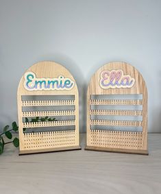 two wooden calendars sitting on top of a table