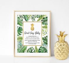 a gold pineapple next to a framed tiki bar sign