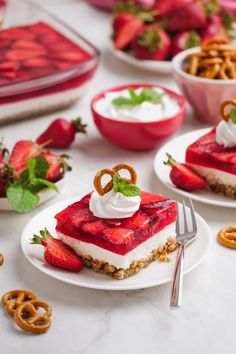 strawberry cheesecake dessert with pretzels and strawberries on the side, ready to be eaten