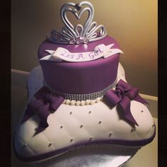 a purple and white cake with a tiara on top