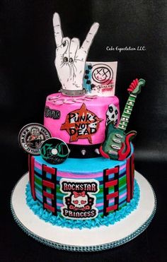 a colorful cake decorated with rock and roll decorations