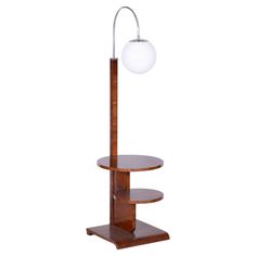 a lamp that is on top of a stand