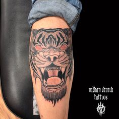 a man's arm with a tiger tattoo on it and the words meander durch tattoos