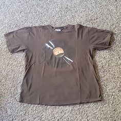 Rare Coachella Shirt, Some Wear Looks Great Brown Short Sleeve Shirt For Streetwear, Casual Brown Shirt With Graphic Print, Relaxed Fit Brown Shirt With Crew Neck, Brown Relaxed Fit Crew Neck Shirt, Brown Crew Neck Graphic Tee Shirt, Brown Crew Neck Graphic Tee, Brown Relaxed Fit Shirt For Streetwear, Brown Relaxed Fit Streetwear Shirt, Brown Short Sleeve Shirt With Graphic Print