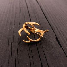 The crown jewel of Moon Raven's Natural World Collection, this unique creation takes the elegant design of a whitetail deer antler and wraps it around your finger. Perfect for those seeking a combination of rare beauty and the chance to keep a connection to nature close at hand. This solid-cast gold plated ring is available in sizes from  3.5 to 9.5. MATERIAL: Gold Plated Stainless Steel QUESTIONS: We are always happy to answer any of your questions, so please contact us via convo, we would love Gold Wrap Ring, Whitetail Deer, Deer Antlers, Crown Jewels, Gold Plated Rings, Wrap Rings, Gifts For Nature Lovers, Antlers, Woodland Animals