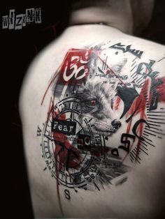 the back of a man's shoulder with an image of a wolf on it