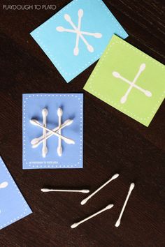 paper snowflakes are cut out and placed on the table