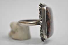 "Mahogany Jasper ring sterling silver natural earth tones women Size 8.75 Weight 10.1g Widest part of band 1 1/8\" Thinnest part of band 1/8\" Free Domestic Shipping and Free Postal Insurance Delivered in a gift Box If you do not want the ring polished and want to leave the natural patina please let me know at the time of purchase as I do polish rings before I ship rings out. Thanks USPS Domestic Shipping is free for buyers. If a buyer prefers to upgrade to priority, the buyer will pay that port Unique Jasper Ring Jewelry, Artisan Brown Gemstone Rings, Brown Large Stone Ring Jewelry, Brown Large Stone Ring, Collectible Brown Gemstone Rings, Brown Sterling Silver Cabochon Ring, Brown Sterling Silver Ring With Cabochon, Adjustable Brown Sterling Silver Ring, Adjustable Brown Gemstone Rings