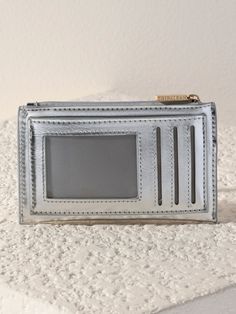 Easily move your key items from handbag to handbag with Shiraleah's Maddie Card Case. Made from trendy metallic PU in a chic silver color, this practical miniature wallet features a sturdy gold key-chain to attach to your favorite bag or key ring. With multiple slip pockets and credit card slots as well as a top-zip closure, it’s the perfect mini essential to carry in along on a night on the town. Pair with matching items from the Maddie Collection, or other items from Shiraleah to complete your Baby Bubble Romper, Tech Bag, Work Tote Bag, Baby Bubble, Gold Key, Accessories Display, Back Jewelry, Stocking Stuffer Gifts, Leather Hobo Bag