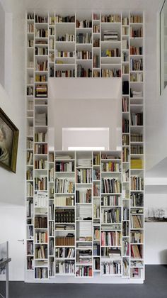 a room filled with lots of books on top of shelves