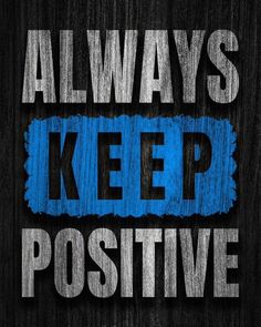 the words always keep positive are painted on a black background with blue and white paint