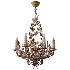 A cheery patinated Italian six-light tôle flower chandelier from the 1960s. The charming piece will add a touch of freshness to whatever room you place it in. Measures: Diameter 50 cm. Height fixture 60 cm. Total height 80 cm. Six E14 bulbs. Italian Flowers, Starburst Chandelier, Chandelier Makeover, Porcelain Dolls For Sale, Blown Glass Chandelier, Flower Chandelier, Flush Mount Chandelier, Shop Displays, Floral Chandelier