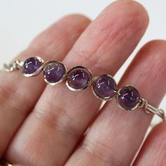 Amethyst Bead Bracelet Sterling Silver Wirewrapped Bracelet - Etsy Silver Amethyst Bracelets Hand Wrapped, Hand Wrapped Purple Bracelets, Purple Amethyst Wire Wrapped Bracelets, Wire Wrapped Purple Amethyst Bracelets, Wire Wrapped Amethyst Bracelets In Purple, Adjustable Nickel-free Crystal Bracelet For Healing, Purple Wire Wrapped Bangle Jewelry, Wire Wrapped Amethyst Bracelet, Adjustable Wire Wrapped Crystal Bracelet With Round Beads