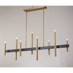 a large rectangular chandelier with six candles hanging from the bottom and four lights on each end