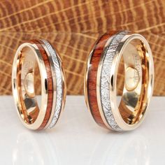 two gold wedding rings with wood inlays